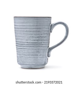 Side view of handmade rough ceramic coffee mug isolated on white