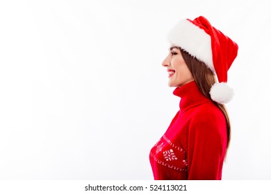 Side View Of Happy Woman In Santa Hat On White Background.