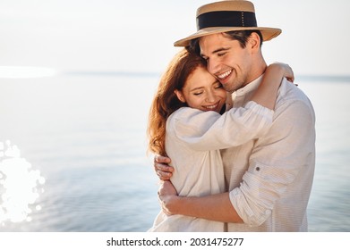 Side view happy young couple two family man woman wear casual clothes girlfriend hugging boyfriend rest date at sunrise over sea sand beach ocean outdoor exotic seaside in summer day sunset evening - Shutterstock ID 2031475277