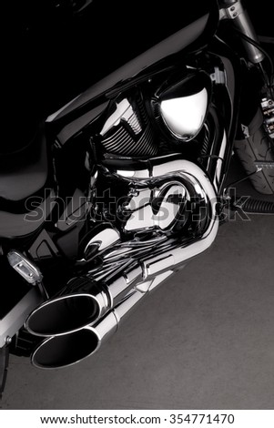 Side view of a harley style chopper motorcycle with shiny chrome parts
