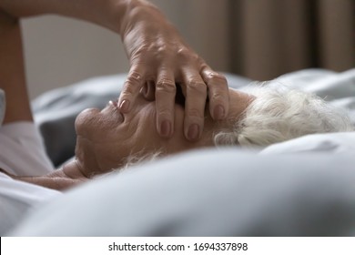 Side View Head Shot Close Up Unhappy Mature Retired Woman Lying In Bed, Covering Eyes With Hand, Suffering From Sleep Disorder. Sleepless Senior Older Grandma Feeling Lack Of Energy, Insomnia Concept.