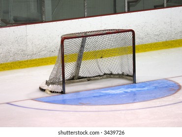 Side View Of A Hockey Net And An Older Half-circle Crease Painted A Nice Shade Of Blue