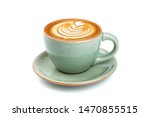 Side view of hot latte coffee with latte art in a ceramic green cup and saucer isolated on white background with clipping path inside. Image Stacking Techniques.