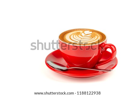 Side view of hot latte coffee with latte art in a bright red cup and saucer isolated on white background with clipping path inside.