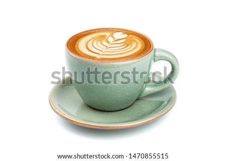 Side view of hot latte coffee with latte art in a ceramic green cup and saucer isolated on white background with clipping path inside. Image Stacking Techniques.