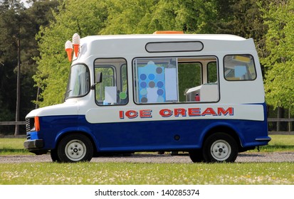 Side view of ice cream van in green countryside