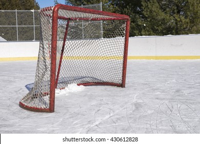 A Side View Of An Ice Hockey Net On An Ice Rink.