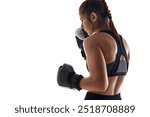 Side view image of sweating, focused young woman, boxing athlete in globes,. practicing isolated on white studio background. Concept of sport, hobby, active and healthy lifestyle, marital arts