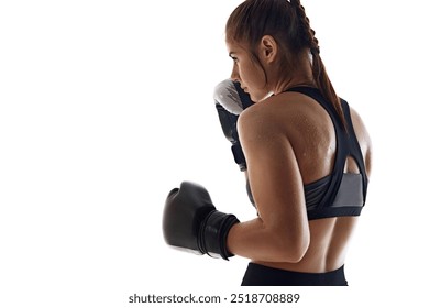 Side view image of sweating, focused young woman, boxing athlete in globes,. practicing isolated on white studio background. Concept of sport, hobby, active and healthy lifestyle, marital arts - Powered by Shutterstock