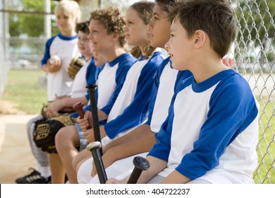 Side View Little League Baseball Team Waiting To Bat