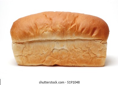 Side View Of A Loaf Of White Bread, Not Sliced, On A White Background