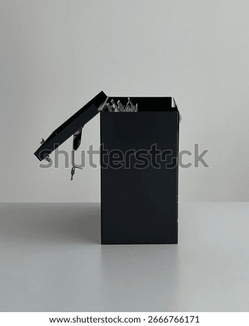 Side view locked file box with key.