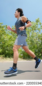  Side View Low Angle Of Asian Man Running On The Countryside