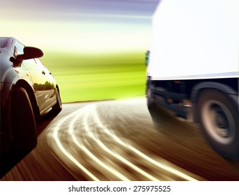 Side View Of A Luxury Car Driving Fast On A Winding Road In The Woods