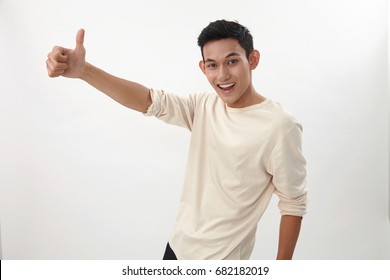 Side View Of Malay Teenage With Thumb's Up