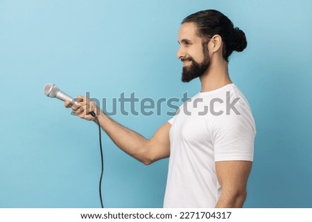 Similar – Image, Stock Photo Journalist holding microphone making media interview