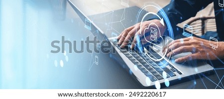 Side view of man hands typing on computer keyboard, cloud service hologram hud, files transfer between devices. Concept of data share, synchronization and storage. Copy space
