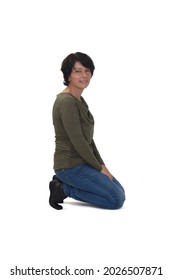 Side View Of A Man Kneeling On White Background Looking At Camera