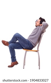 Side View Of A Man Sitting On A Chair. Isolated Over White Background.