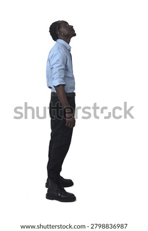 side view of a man standing  look up on white background