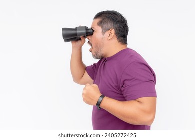 Side view of a man startled upon seeing something shocking with his binoculars. Wearing a purple waffle shirt, isolated on a white background.