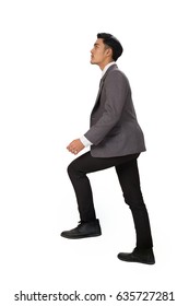 Side View Of A Man Stepping Up A Staircase. Confident Businessman Walking Up The Career Stairs. Concept Of Person Walking To The Success