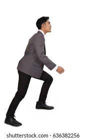 Side View Of A Man Stepping Up A Staircase. Confident Businessman Walking Up The Career Stairs. Concept Of Person Walking To The Success