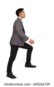 Side View Of A Man Stepping Up A Staircase. Confident Businessman Walking Up The Career Stairs. Concept Of Person Walking To The Success