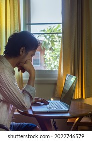 Side View Of man Using Laptop At Home.Comfort zone concept