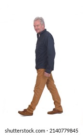 Side View Of A Man Walking On White Background Looking At Camera On White Background