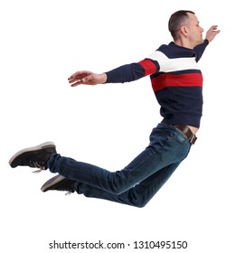 Side View Of Man In Zero Gravity Or A Fall. Guy Is Flying, Falling Or Floating In The Air. Side View People Collection.  Side View Of Person.  Isolated Over White. The Guy In Jeans Soars In The Air.