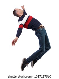 Side View Of Man In Zero Gravity Or A Fall. Guy Is Flying, Falling Or Floating In The Air.   Side View Of Person.  Isolated Over White Background. Stylish Guy In A Sweater In Zero Gravity.