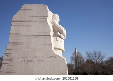 Side View Of The Martin Luther King Jr Memorial In Washington DC Showing Profile Of The Reverend With A Glimpse Of The Washington Monument In The Background