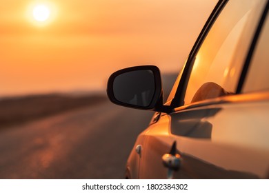 Side View Mirror Of Car On Road In Autumn Sunset For Travel, Car Insurance Or Roadside Assistance Concept, Selective Focus