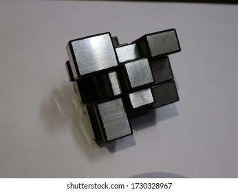 Side View Of The Mirror Cube Puzzle Kept On The Table.