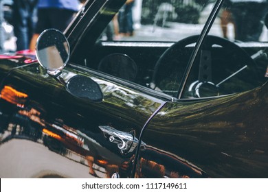Side view mirror of an old classical muscle car