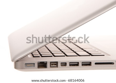 Side view of modern laptop computer with usb, MagSafe power, Gigabit Ethernet port, One FireWire 800, SD card slot isolated on white