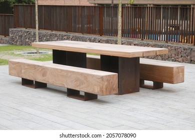 Side View Of A Modern Square Picnic Bench. Modern Picnic Bench From The Side In England.