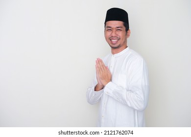 Side View Of Moslem Asian Man Smiling To Give Greeting During Ramadan Celebration