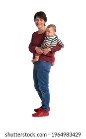 Side View Of A Mother Carrying Her Baby Looking At Camera On White Background