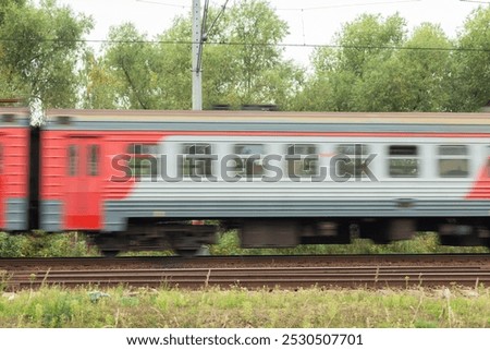Side view of the moving train. Electric high speed passenger commuter train. Intercity express