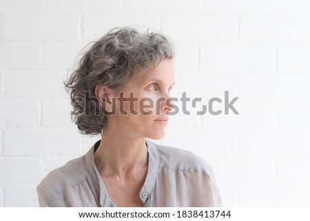 Similar – Image, Stock Photo Side view of focused female hairstylist using electric trimmer on male client’s hair at salon