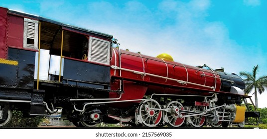 Side view of old black historic vintage british Steam Locomotive Engine at Lucknow railway station in India with beautiful architecture design and color. - Shutterstock ID 2157569035