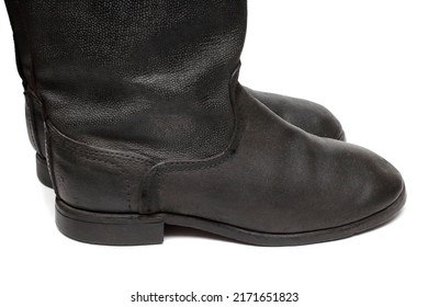 Side view of old military boots made of leather on white background, black army boots isolated on white, combat and ceremonial shoes of a soldier of the army of the Soviet Union