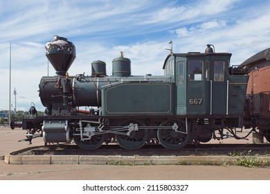 Side View Of A Old Steam Locomotive.