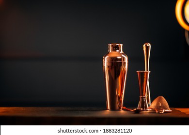 Side View On Copper Bar Tools Set With Shaker On The Wooden Table