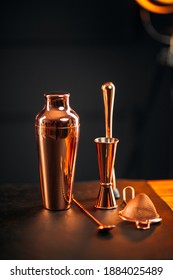 Side View On Copper Bar Tools Set With Shaker On The Wooden Table