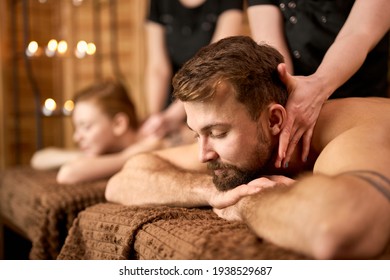 side view on handsome bearded guy relaxing in spa salon
