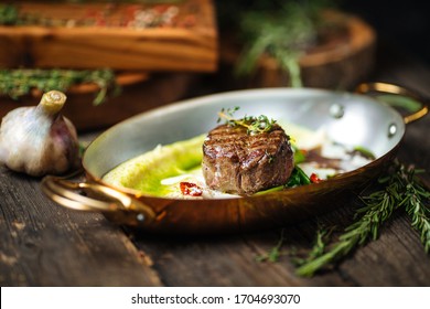 Side View On Italian Recipe Cooked Beef Filet Mignon With Mashed Potatoes And Truffle Sauce In A Pan On The Dark Wooden Table, Horizontal Format