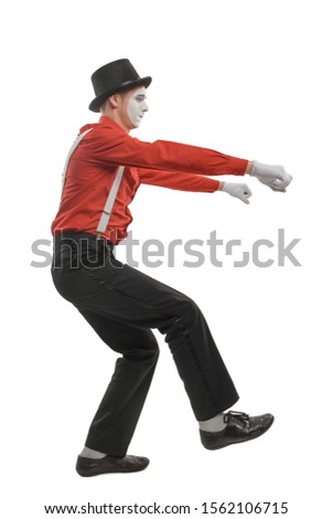 Side view on a man driving a motorcycle, isolated on white. Male mime performing a pantomime with invisible object tricks.